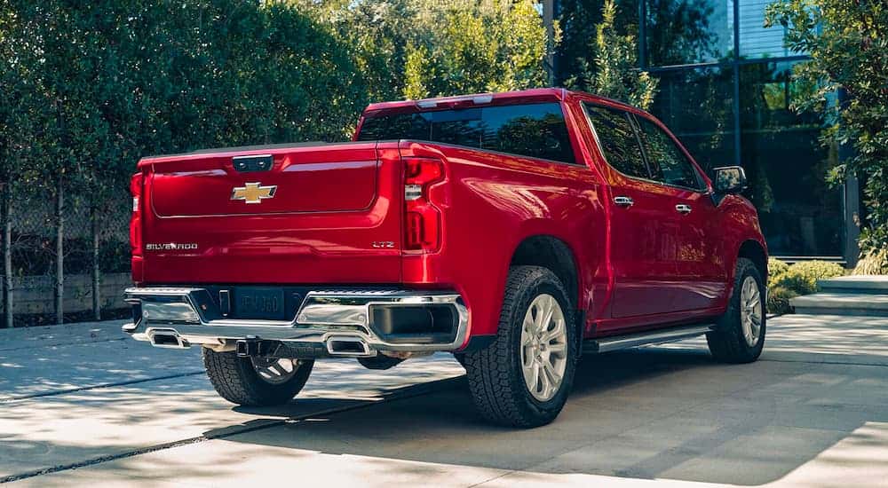 Red 2023 Chevy Silverado 1500 LTZ parked on a driveway