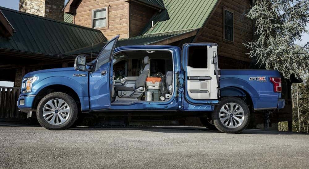 Blue used 2020 Ford F-150 STX for sale near Schenectady with doors open.