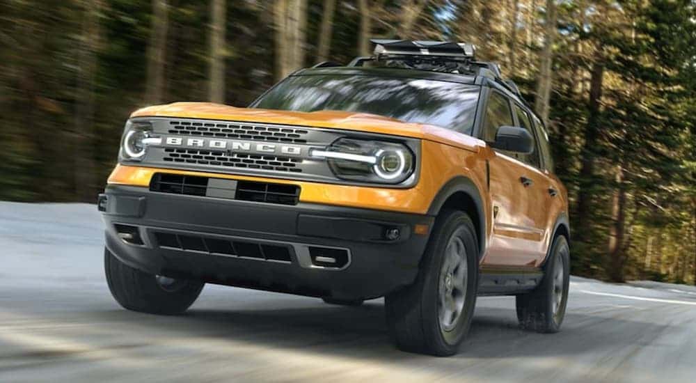 Used yellow 2021 Ford Bronco for sale near Schenectady from the front at an angle.