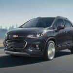 A gray 2020 Chevy Trax driving to view used SUVs for sale in Albany.
