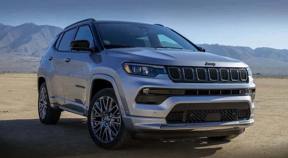 A silver 2023 Jeep Compass parked offroad.