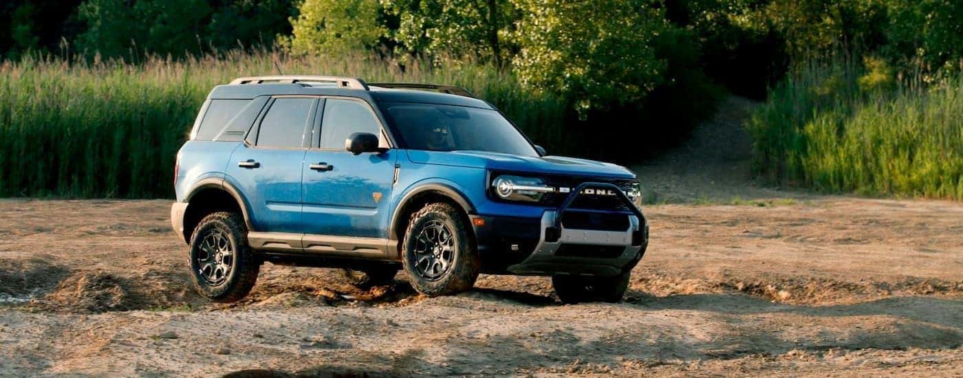 A blue 2024 Ford Bronco Sport from the side fter leaving a dealer that has used SUVs for sale near Colonie.