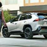 Rear of a white 2020 Toyota RAV4 Hybrid.