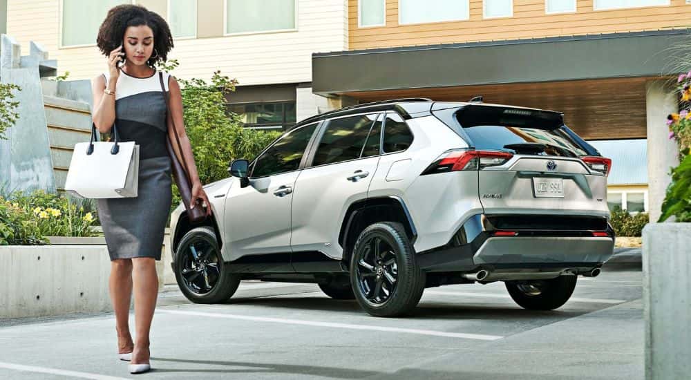 Rear of a white 2020 Toyota RAV4 Hybrid.