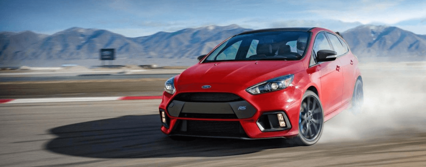 Red 2018 Ford Focus RS drifting on a track