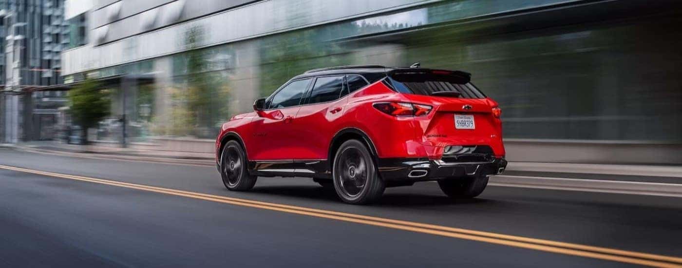 Red 2020 Chevy Blazer RS driving through a city.