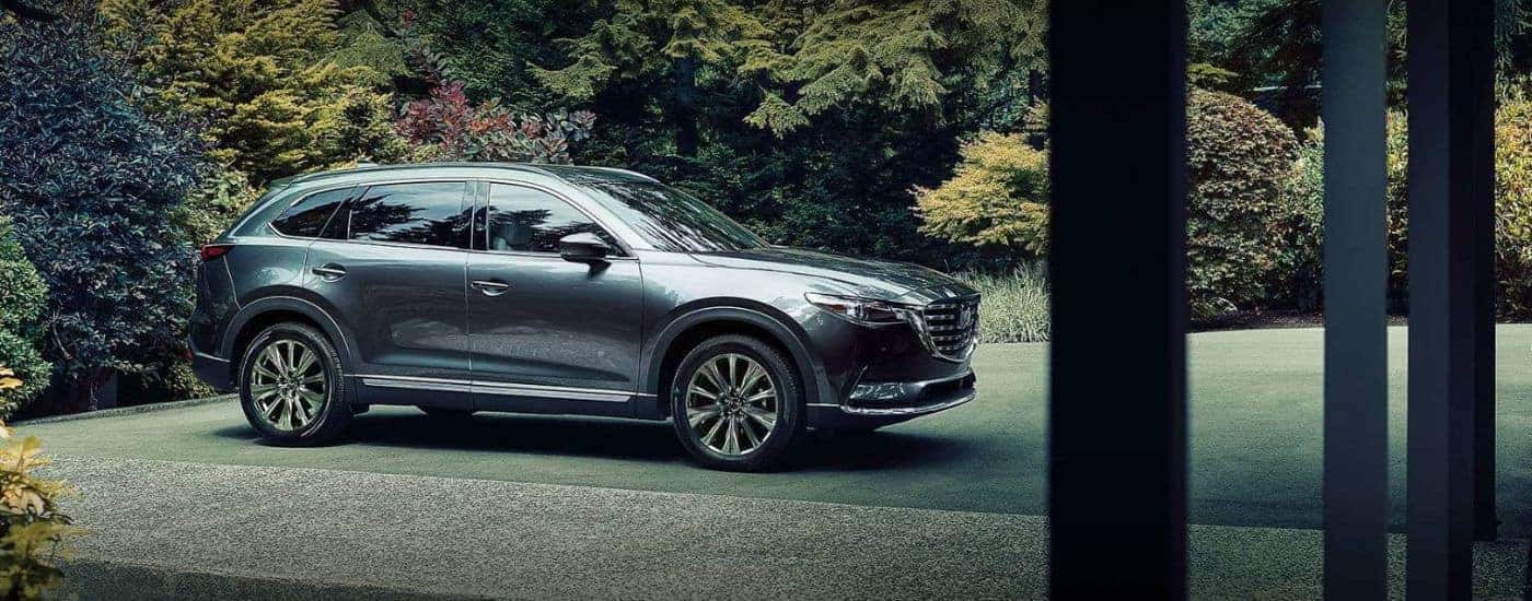 Grey 2021 Mazda CX-9, is shown parked on a driveway.