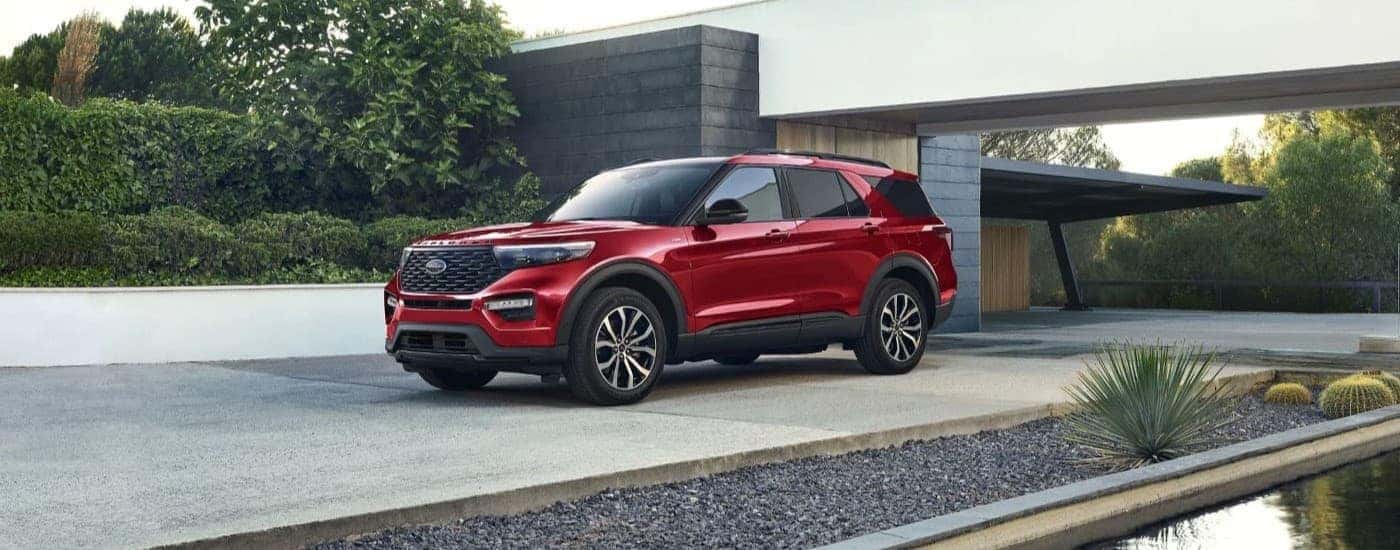 A red 2023 Ford Explorer ST is shown parked on a driveway