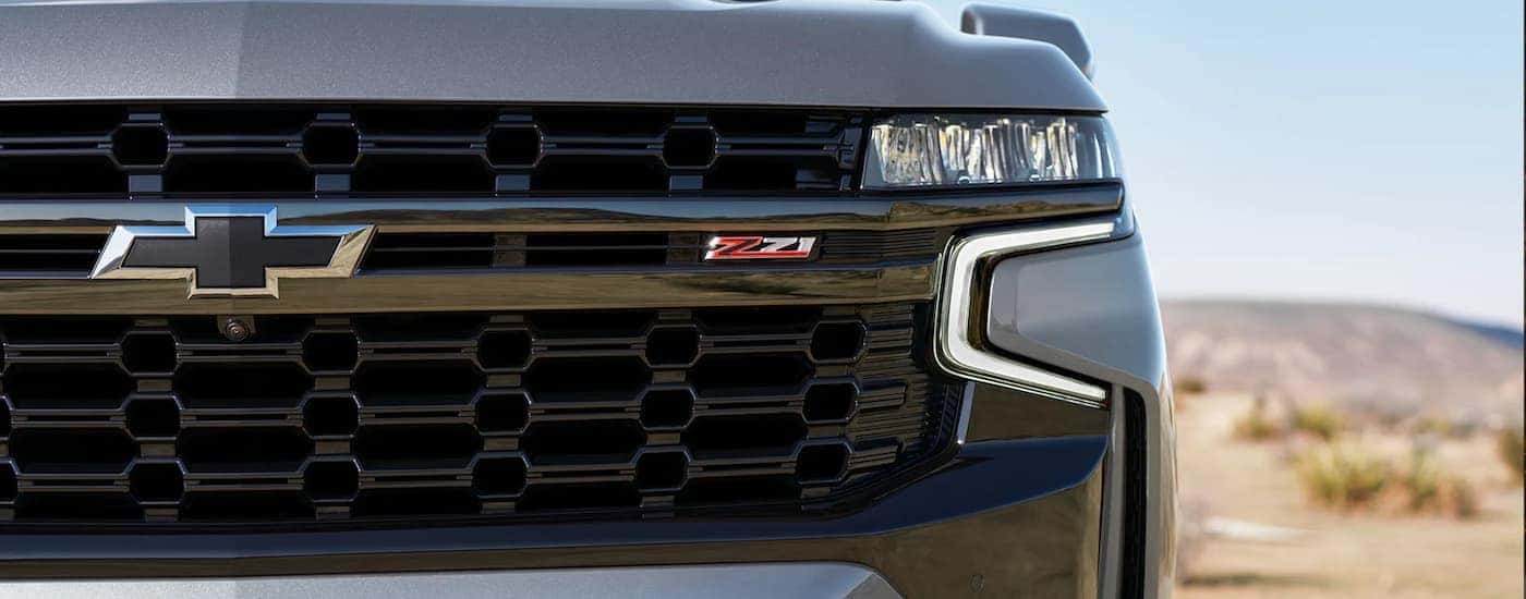 Grille and headlight on a grey 2022 Chevy Suburban Z71