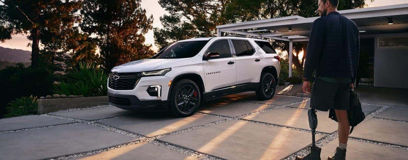 White 2023 Chevy Traverse, is shown parked on a driveway.