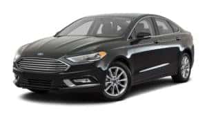 A black 2017 Ford Fusion is facing left.