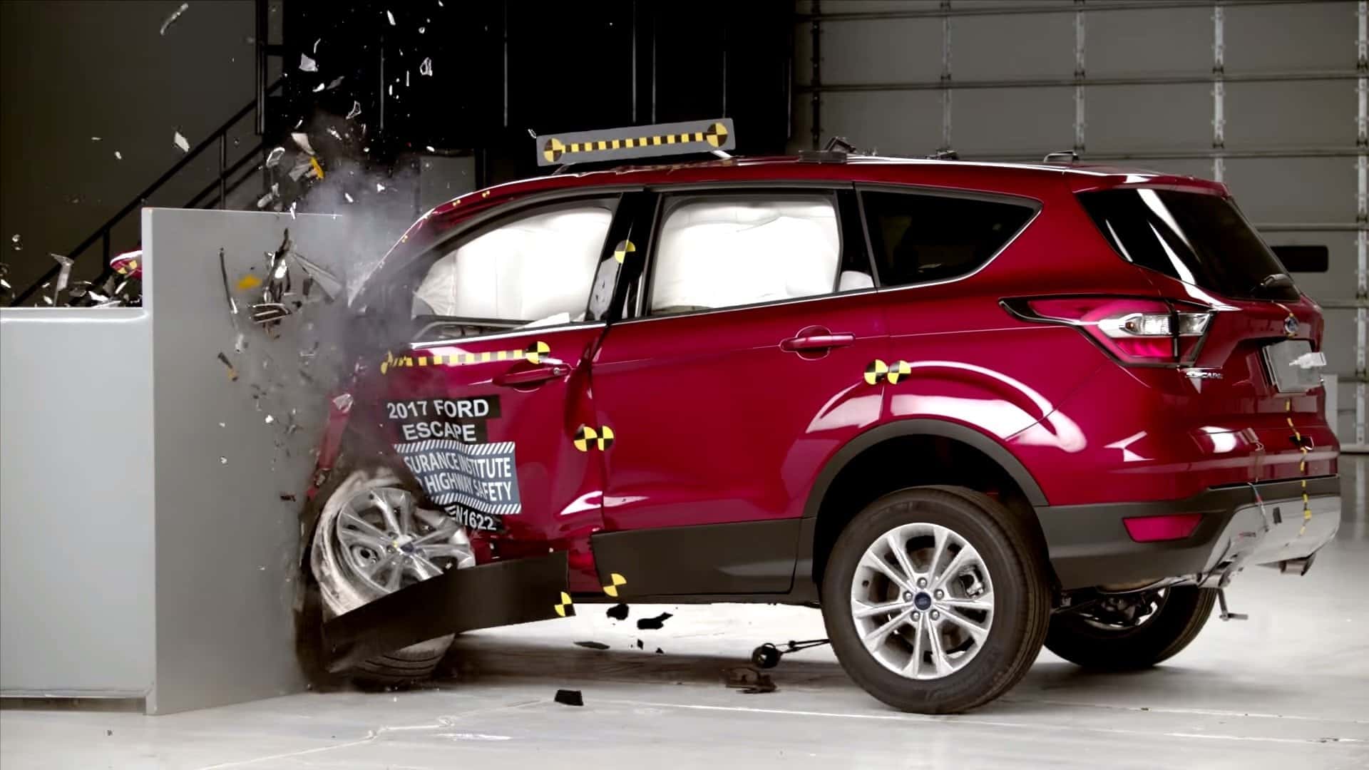A red 2017 Ford Escape is crashing into a wall at a safety testing facility near Albany, NY.