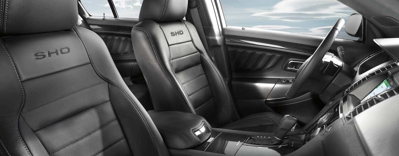 The black interior of a 2017 Ford Taurus is shown.
