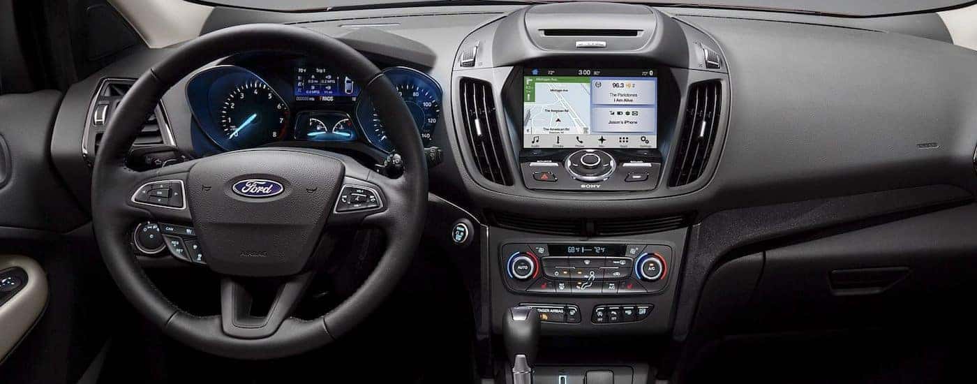 The black dashboard of a 2018 Ford Escape is shown.