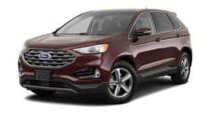 A burgundy 2020 Ford Edge is facing left.