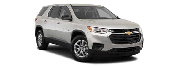 A silver 2020 Chevy Traverse is facing right.