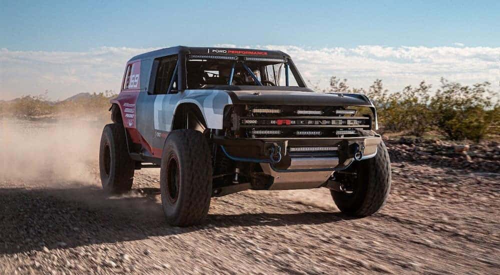 A Race Prototype of the 2021 Ford Bronco, soon to be popular among Ford SUVs, is driving in the desert.