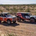 A 1969 Baja 1000 Bronco is racing the 2021 Ford Bronco prototype in the desert.