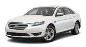 A white 2017 Ford Taurus is facing left.