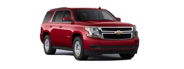 A red 2020 Chevy Tahoe is angled right.