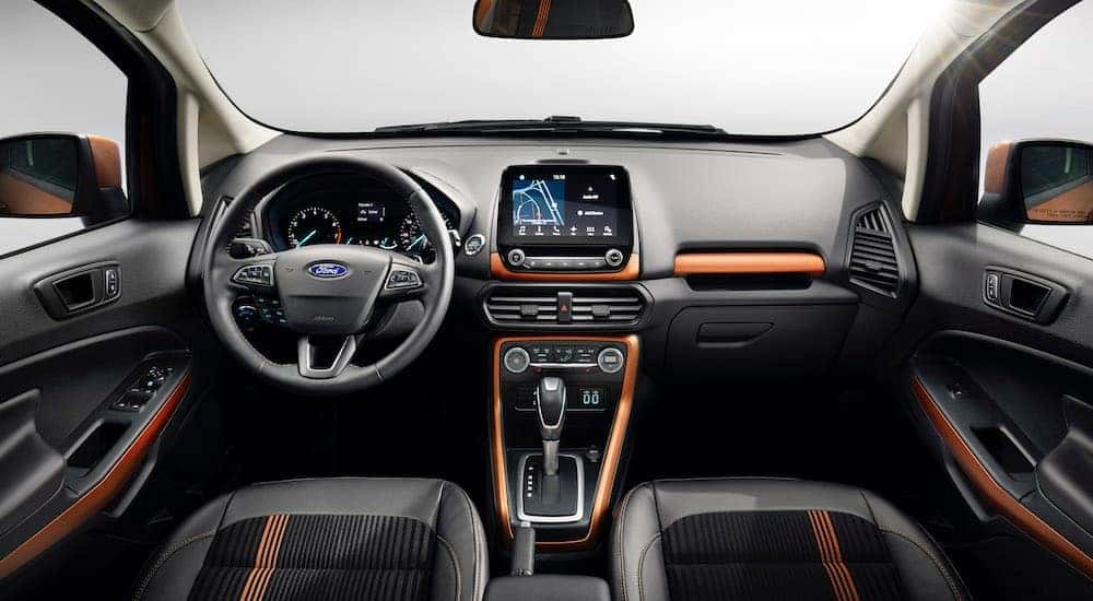 The black interior with orange accents is shown in a 2018 used Ford EcoSport.