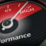 Black and red gauge labeled as "Performance" with the ticker pointing toward "HIGH"