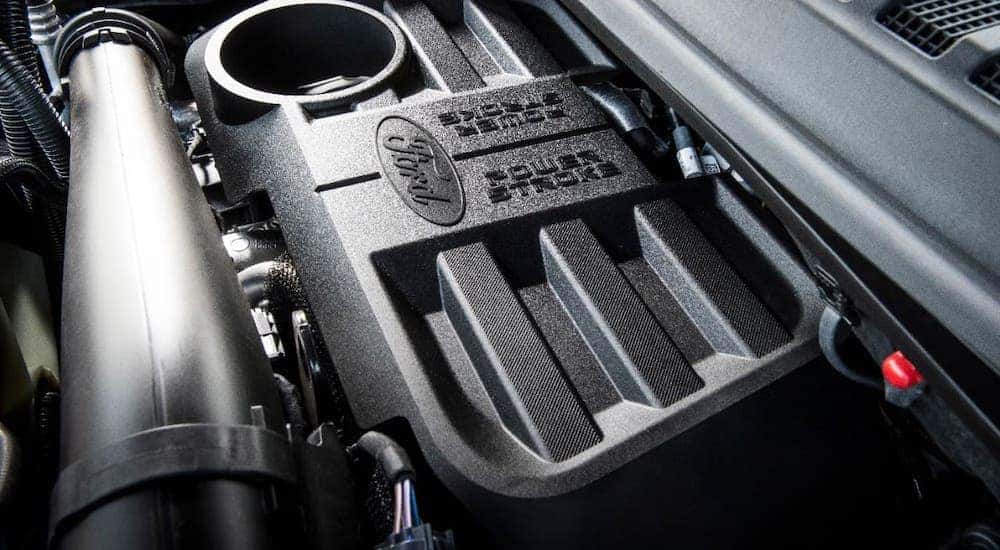 A closeup shows the black Powerstroke engine in a 2020 Ford F-150.