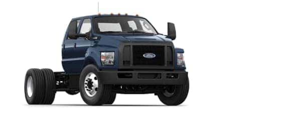 A blue 2021 Ford F-750 is angled right.