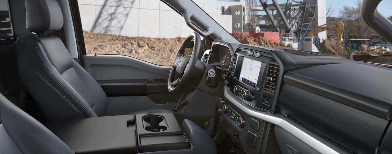 The interior of a 2021 Ford F-150 is shown while on a constuction site.