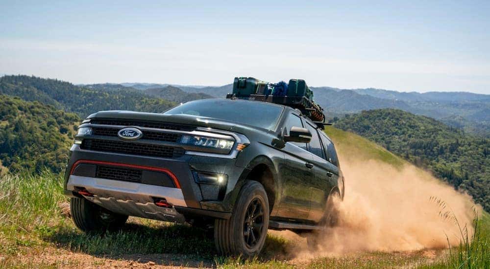 A black 2022 Ford Expedition Timberline is shown driving after reserving a Ford at a local dealership.