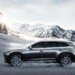 Gray 2016 Mazda CX-9 driving through severe winter conditions