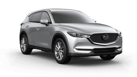 silver 2021 Mazda CX-5 with silver door mirror caps, chrome rims, and chrome accents around the grille