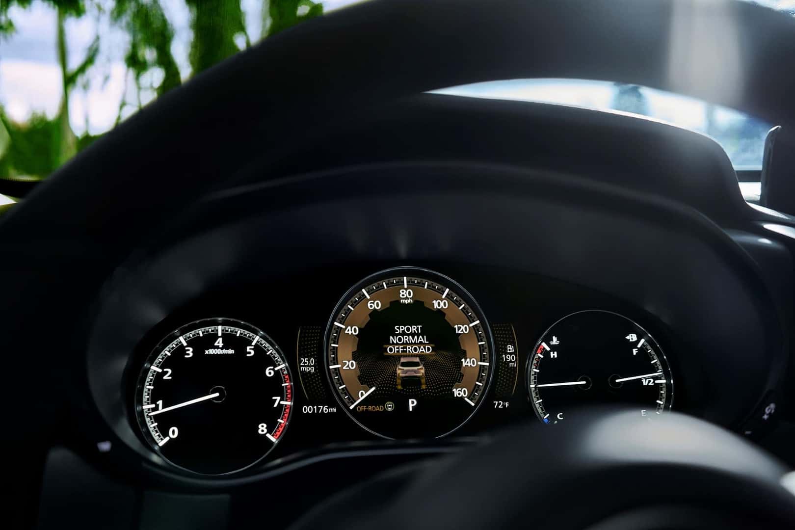 closeup of black dashboard monitor in a 2023 Mazda CX-50 vehicle displaying the drive modes 
