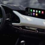 view of mazda vehicle dashboard with Apple CarPlay displayed