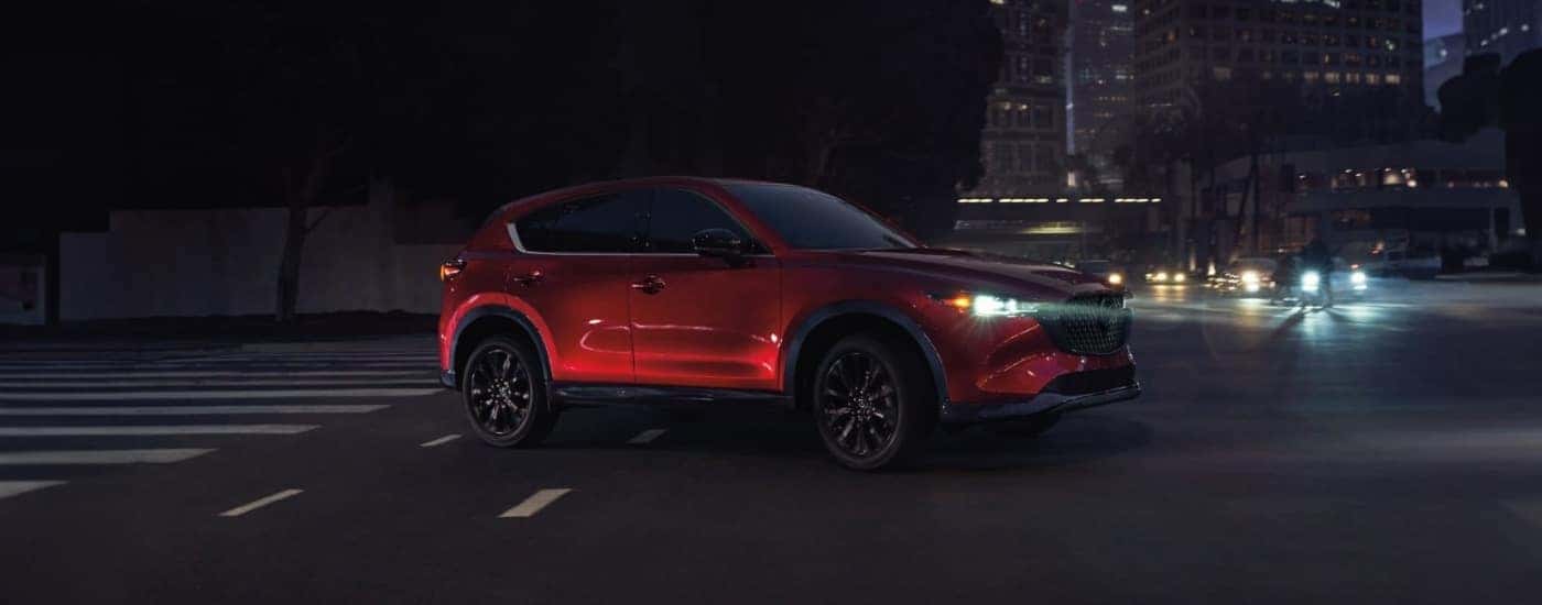a red 2026 Mazda CX-5 from the side.