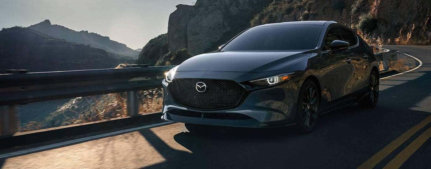 A grey 2026 Mazda3 from the front.