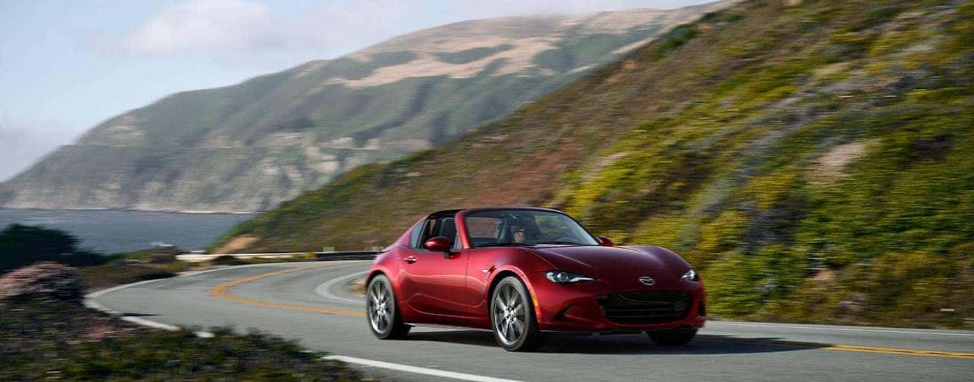 A red 2026 Mazda Miata RF from the front.