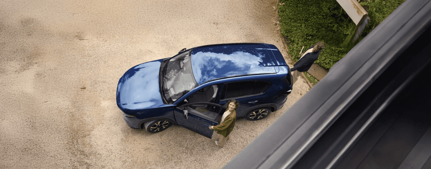 Blue 2026 Mazda CX-5 from above in a driveway