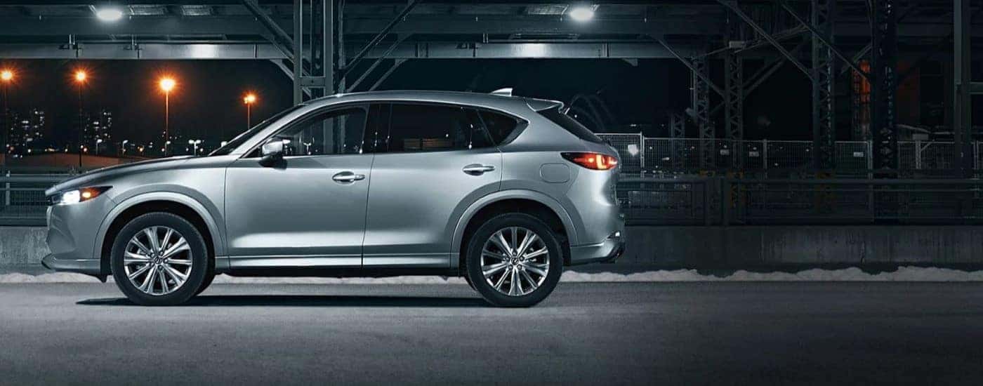 Silver 2023 Mazda CX-5 parked in a lit parking garage