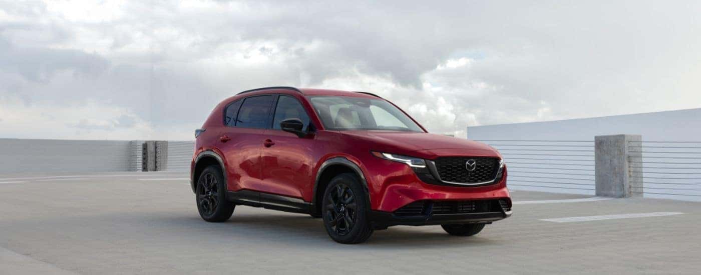 Red 2026 Mazda CX-5 parked on a rooftop.