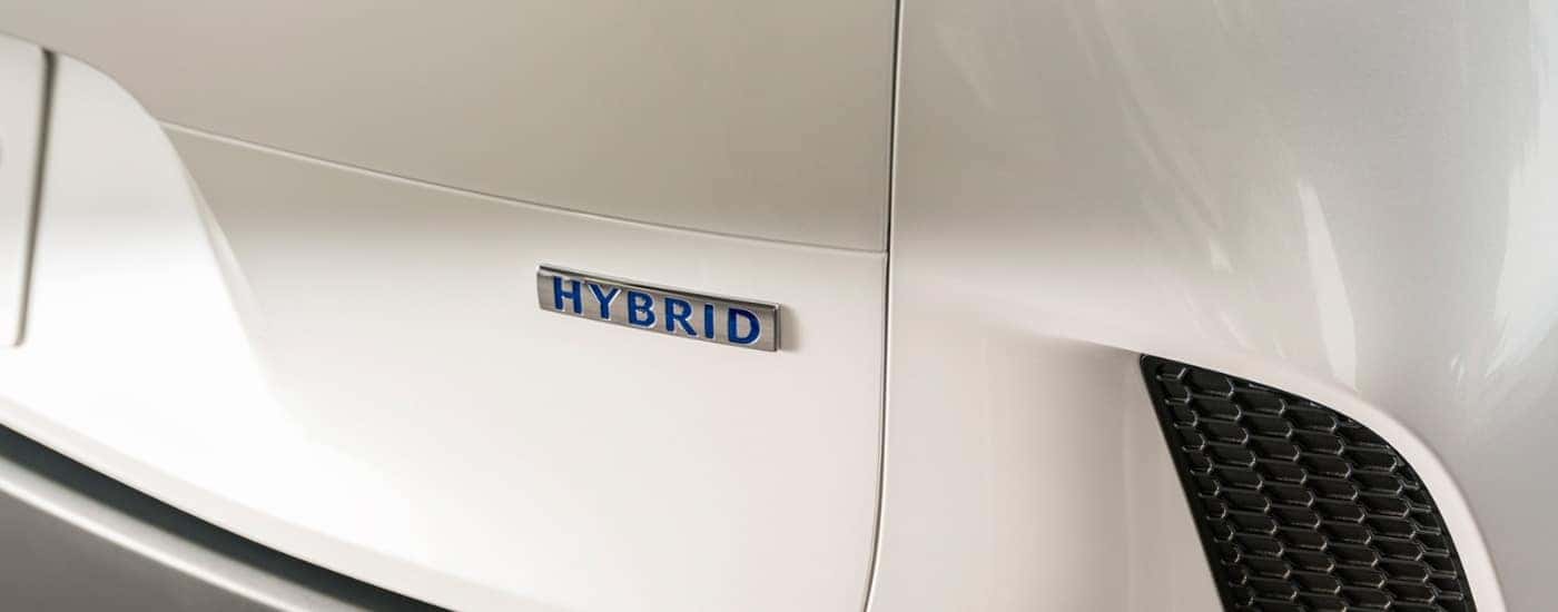 Hybrid badge on a white 2026 Mazda CX-50 Hybrid
