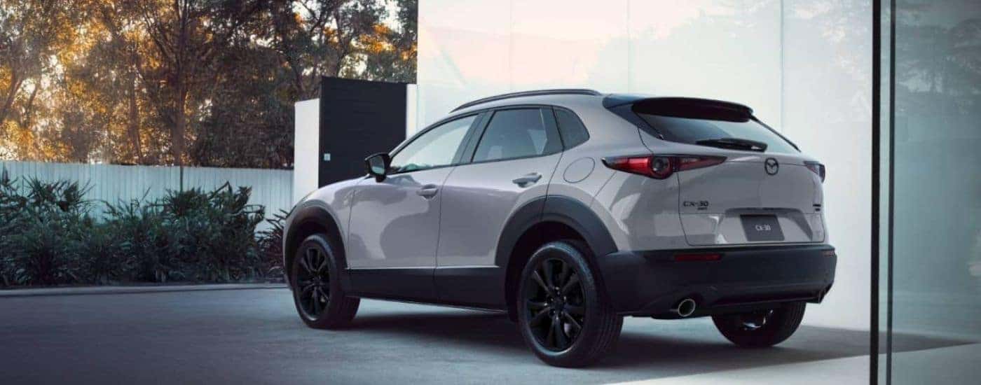 White 2026 Mazda CX-30 from the rear in a driveway.