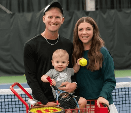 Family with Baby on Tennis Court