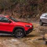 Jeep Cherokee Models Parked On Off-Roading Trails