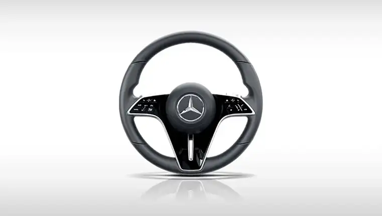 Black Nappa leather steering wheel with silver spokes and touch controls on white