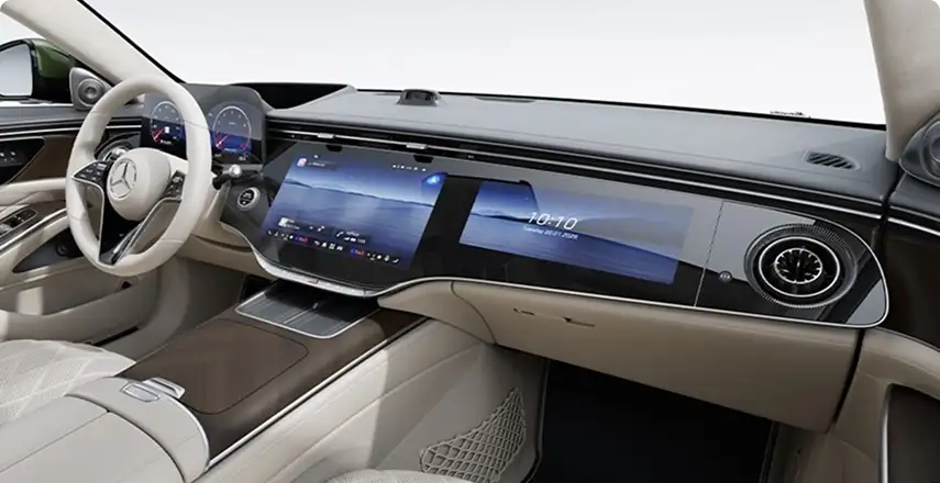 Cream S-Class dashboard with the driver display, central touchscreen and passenger screen