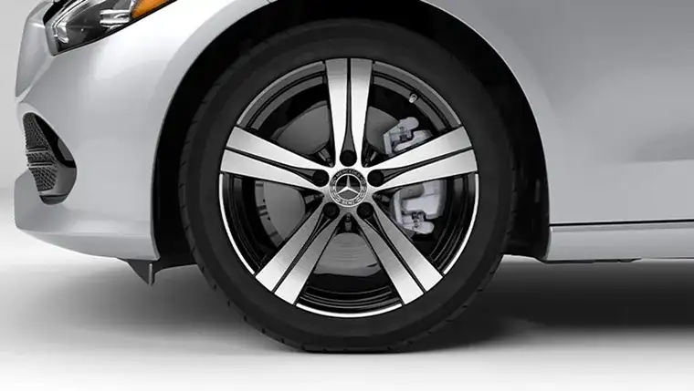 18-inch five-spoke alloy wheel with machine-polished faces and black inlays.