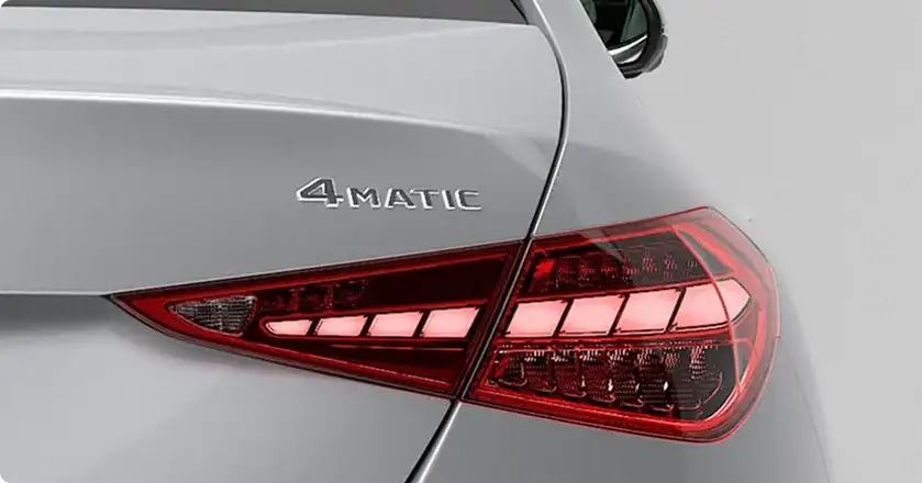 Rear badge and taillamp of a silver C 300 4MATIC Sedan showing the 4MATIC lettering.