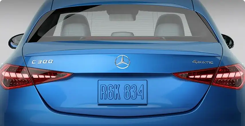 Body-color rear spoiler on the trunk lid of a blue C 300 4MATIC Sedan.