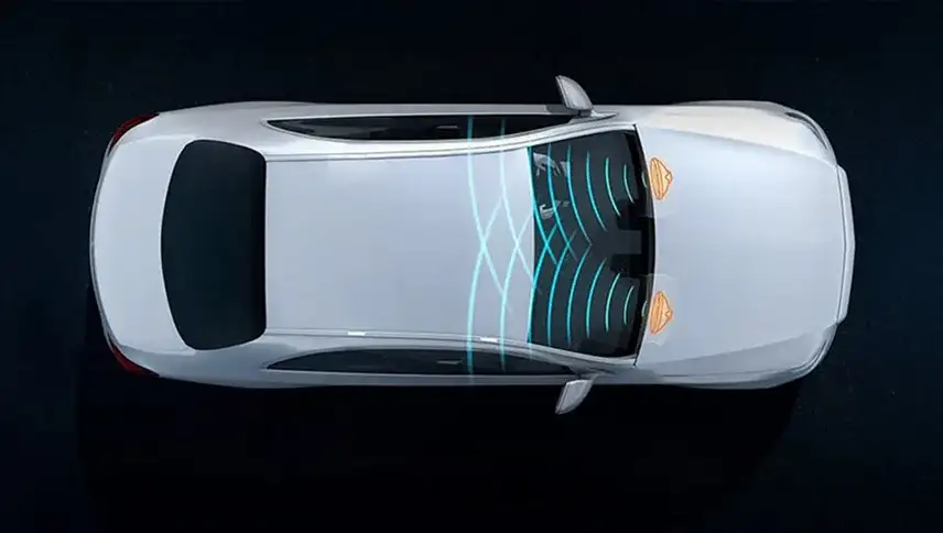 Overhead illustration of the FrontBass subwoofers resonating through the body structure.